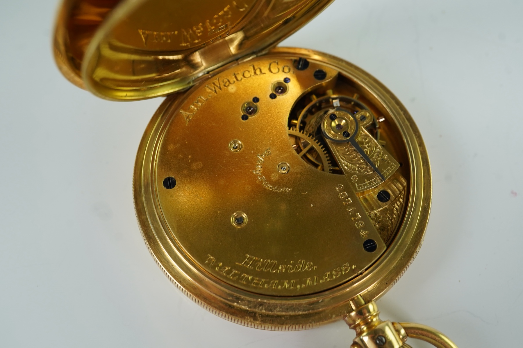 A late Victorian engine turned 18ct gold open faced keyless pocket watch by The American Waltham Watch Company